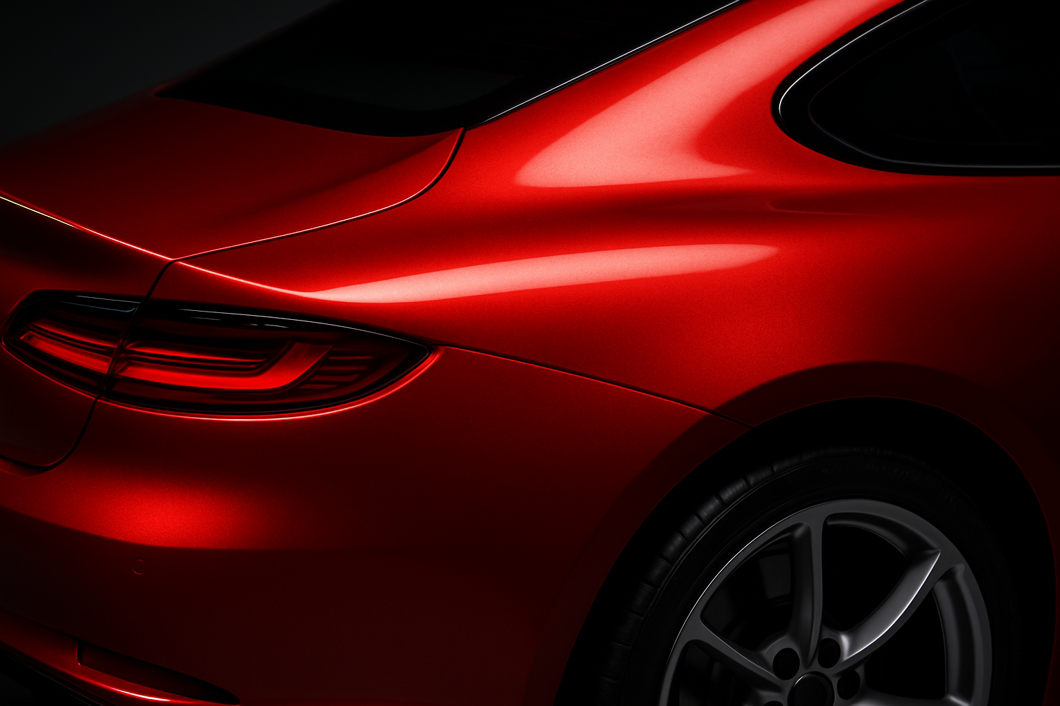 a closeup of a red rear quarterpanel of a sportscar